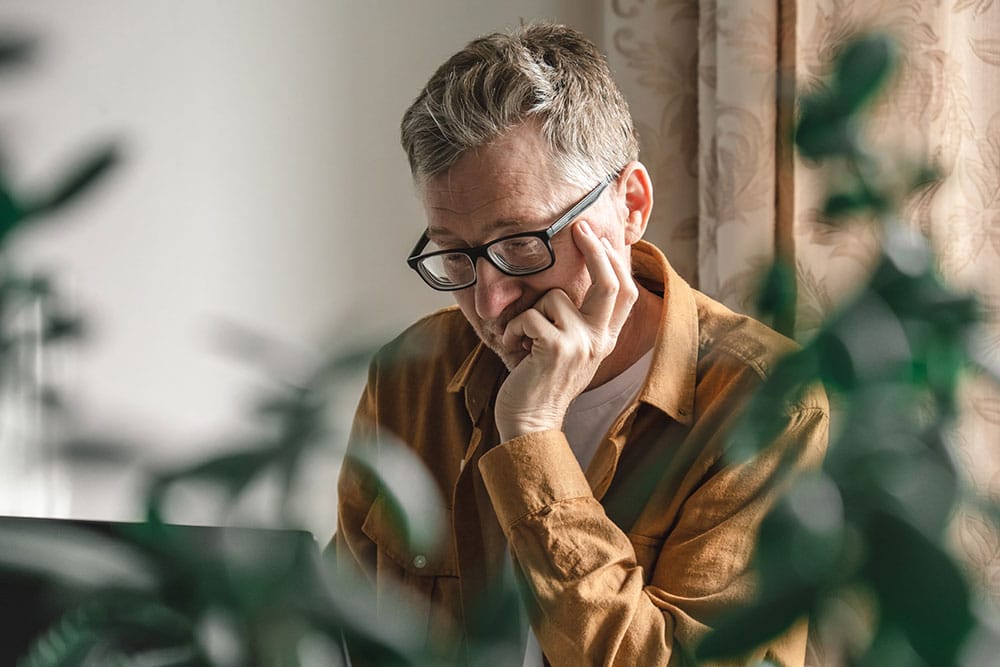 Man reading about stress and the impact on his heart health
